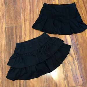 Two black skirts